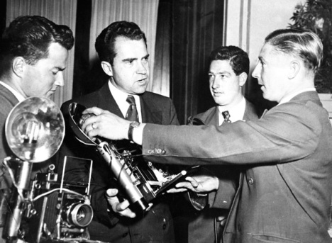 Here is Ern showing his heavy equipment to Richard Nixon,